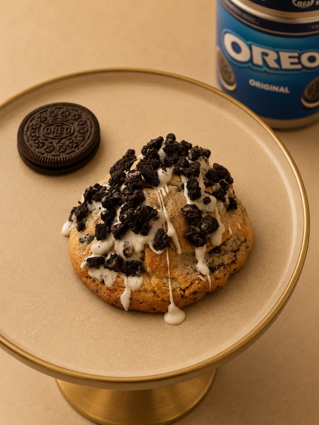 Oreo NYC cookie with white chocolate drizzle and cookie crumb